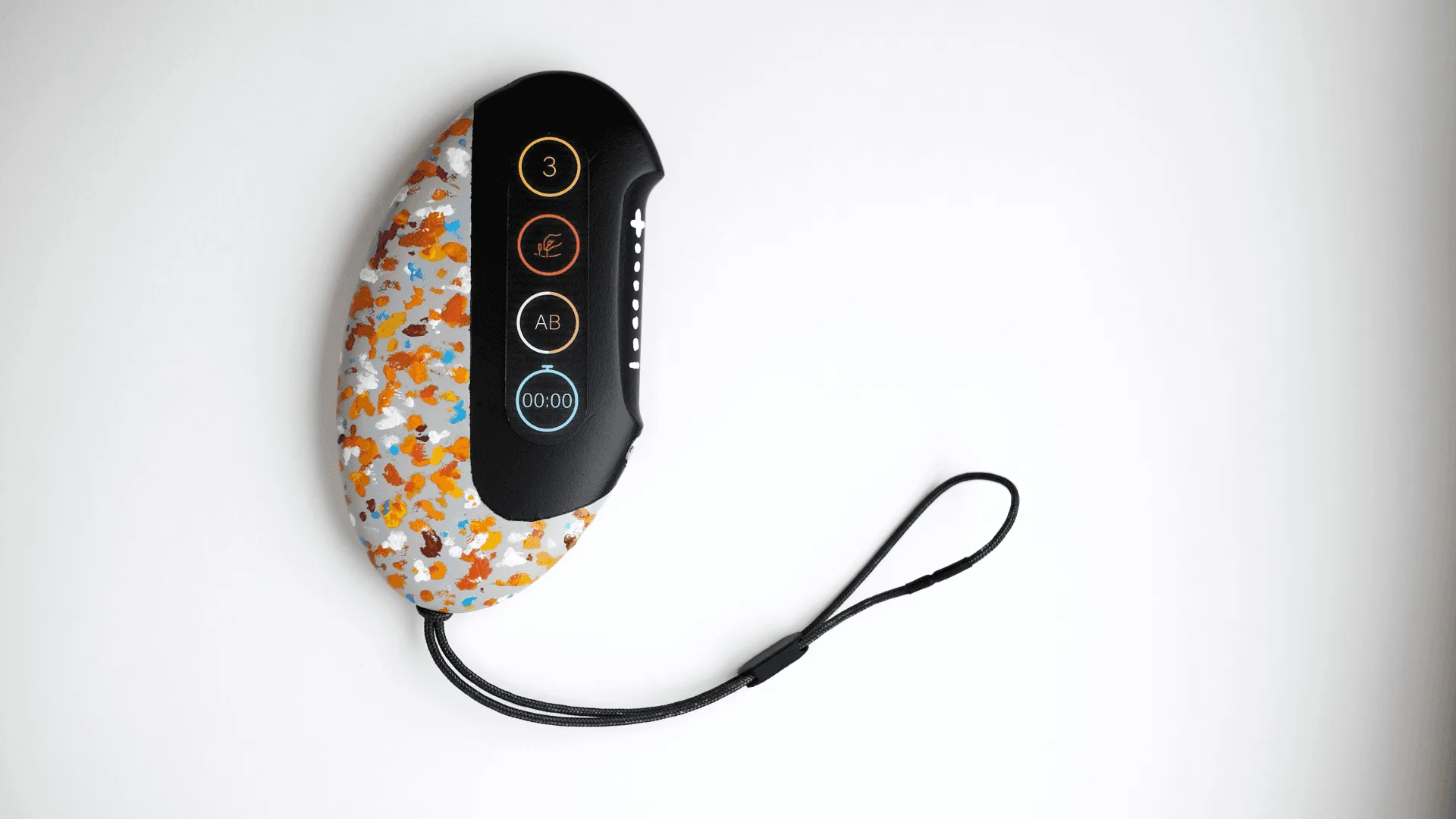 A soft, ergonomic form you can get a firm purchase on. A lanyard attaches it to clothing or a wrist.