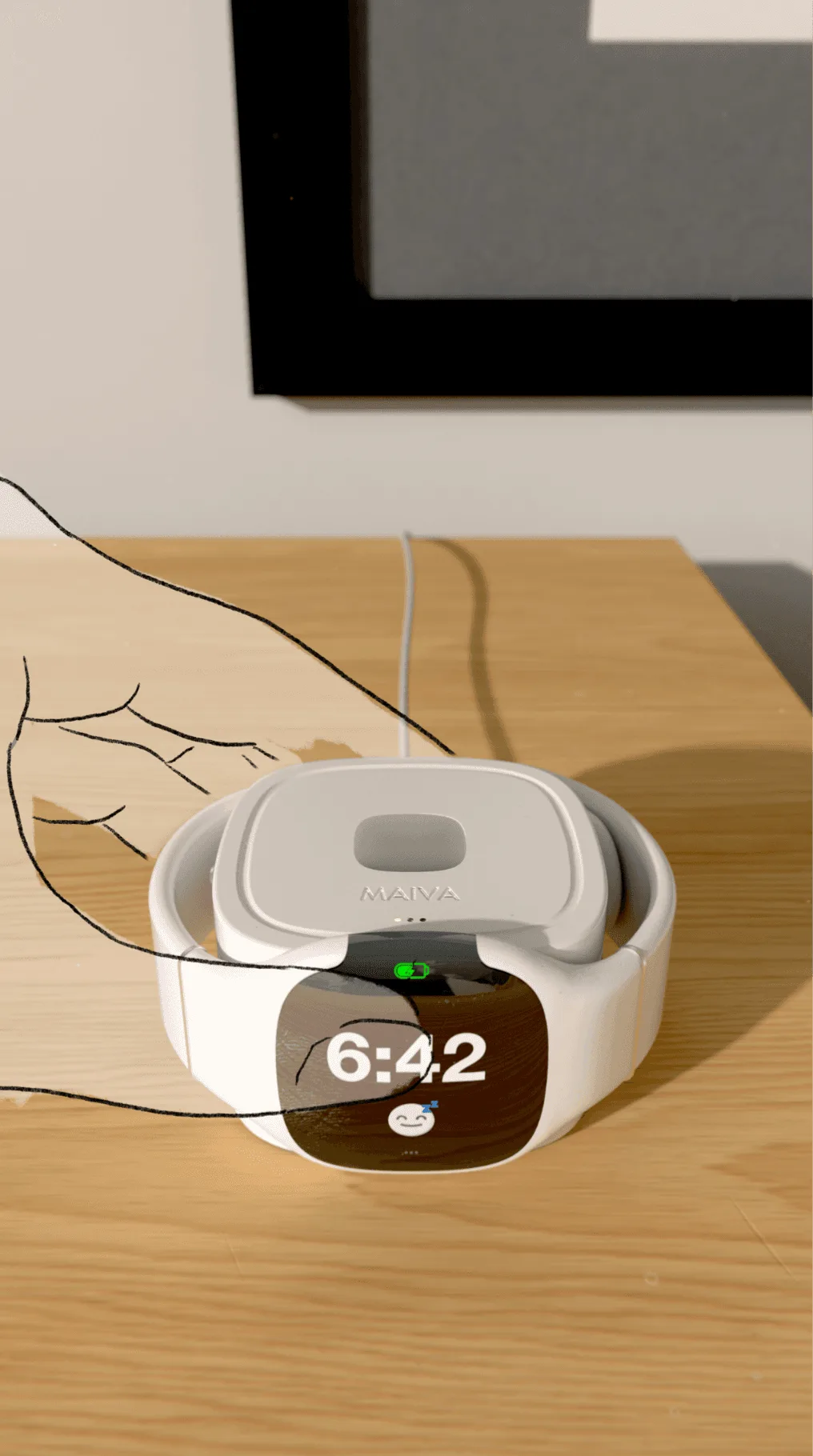 The watch attaches magnetically and charges in front.