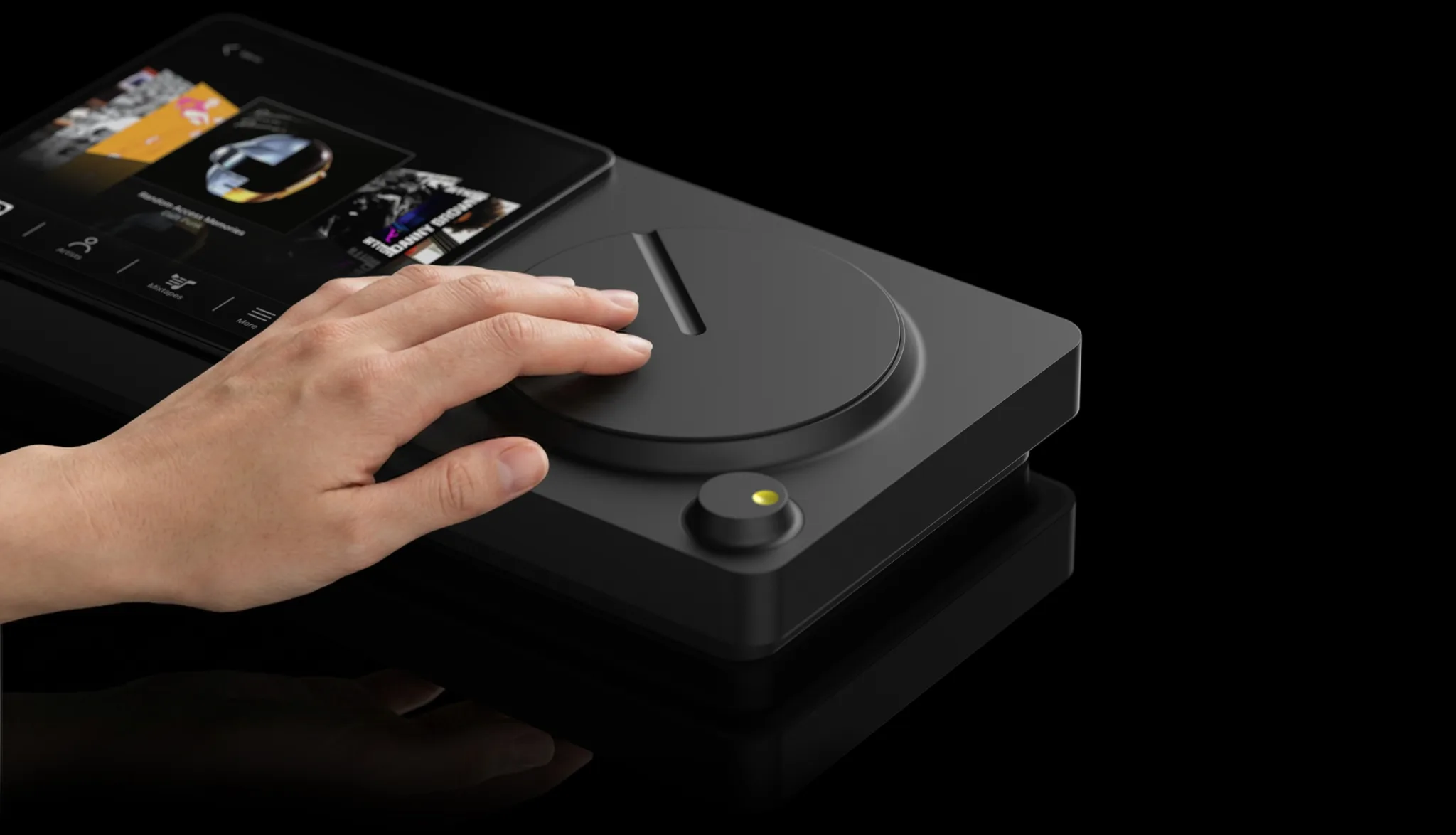 The wheel sits under the hand; the screen stays in view.